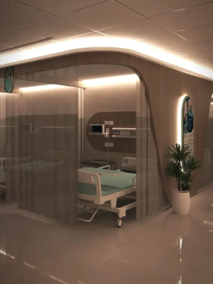 Render detail of a bay in the planned emergency department: a bed and wall-mounted monitor behind sheer curtains, beside a curved wood-panelled wall with a softly lit edge and a potted plant.